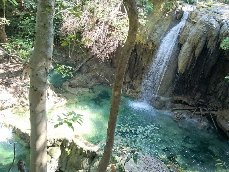 Turquoise limestone pools below Mata Jitu waterfall in the forest of Moyo Island, Sumbawa