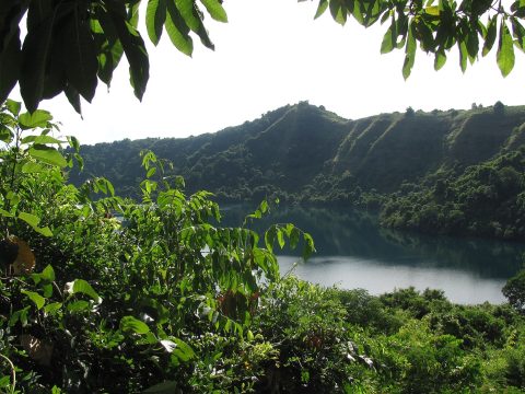 Saltwater crater lake ringed by forest on Satonda Island near Sumbawa